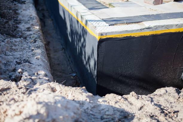 Professional Basement Waterproofing technician working in Montrose, AL